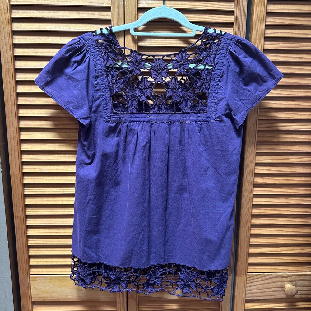 Forever purple top with lace front near chest and bottom of shirt.